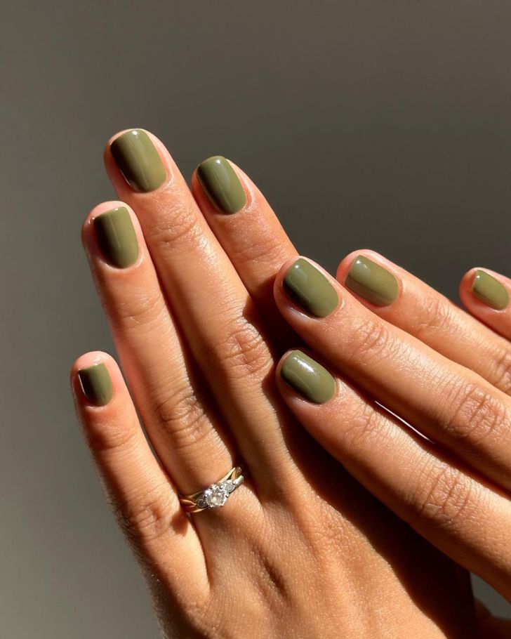 simple short olive green Taylor Swift nails inspired by the Evermore album on the Eras tour