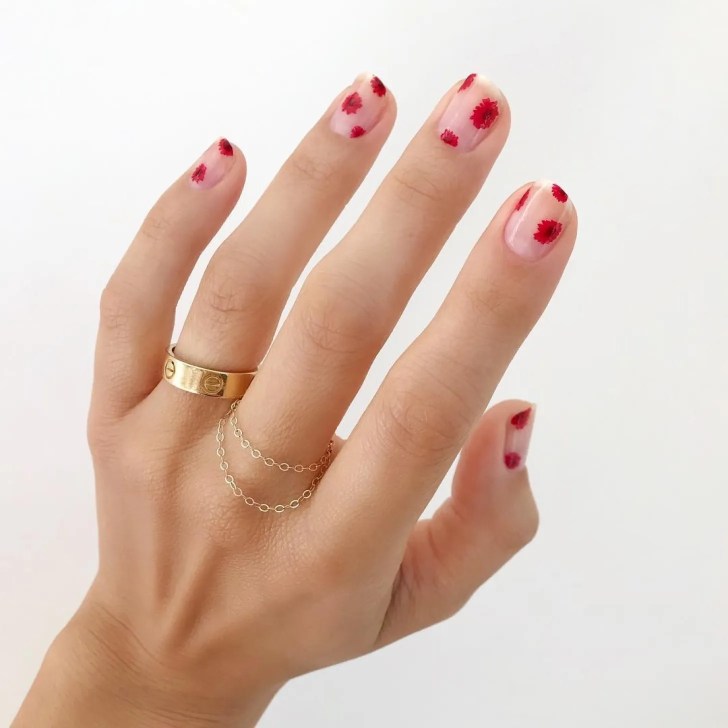 short wedding nails with a delicate red poppy flower design