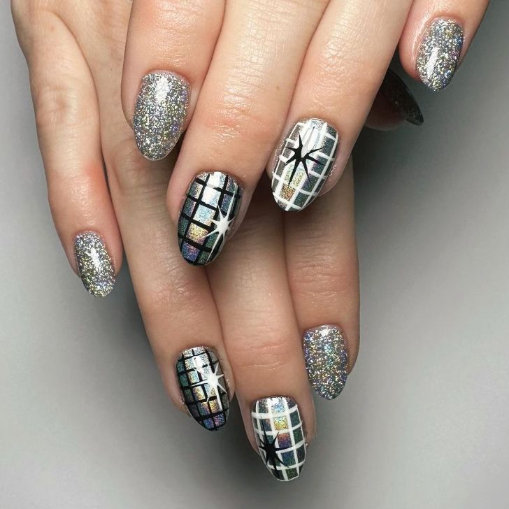 silver glitter new years nails with disco ball themed nail art