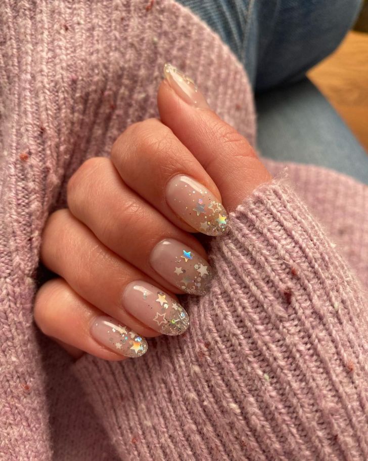 silver glitter ombre new years nails with cute star confetti designs