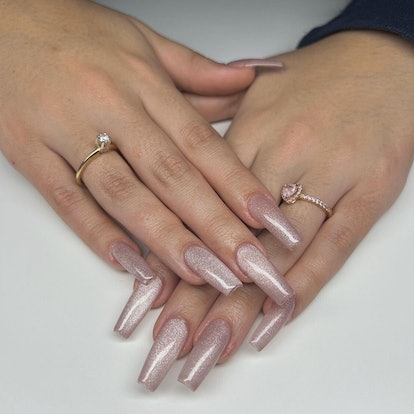With or without a cat eye line, these rose gold velvet nails are on-trend.