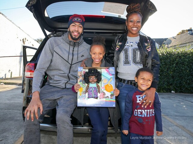 Slideshow-image: Anthony Davis of the New Orleans Pelicans surprises a local family at Kingsley House and gives away a car on December 12, 2017....