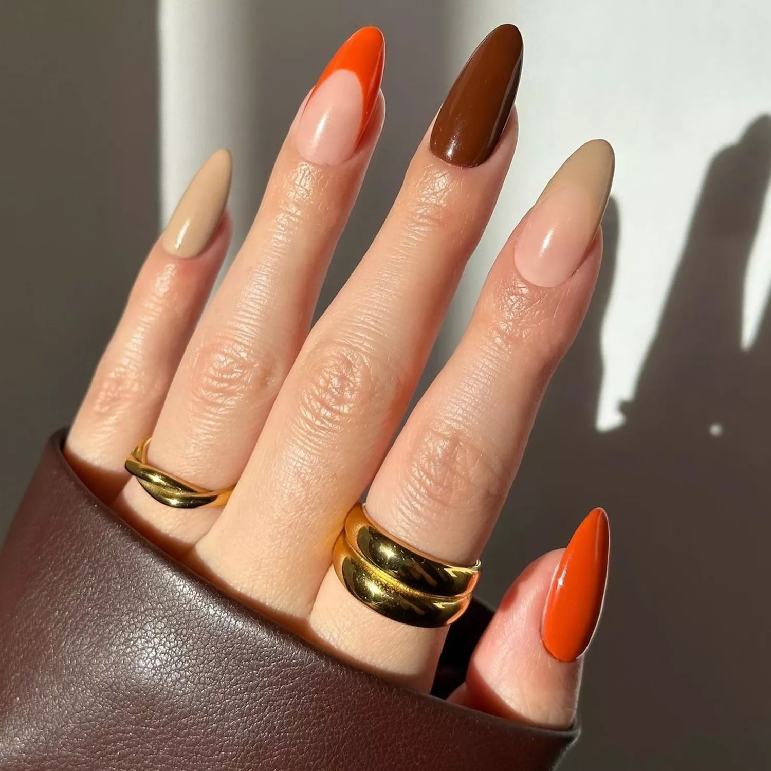 Tan, orange, and brown French mani accent nails