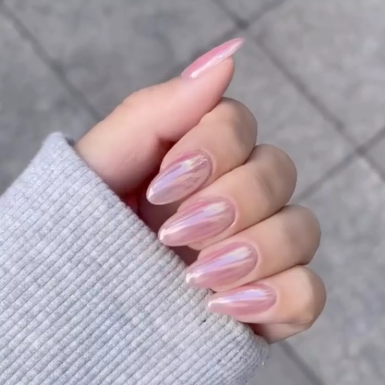 close up of nails with baby pink chrome