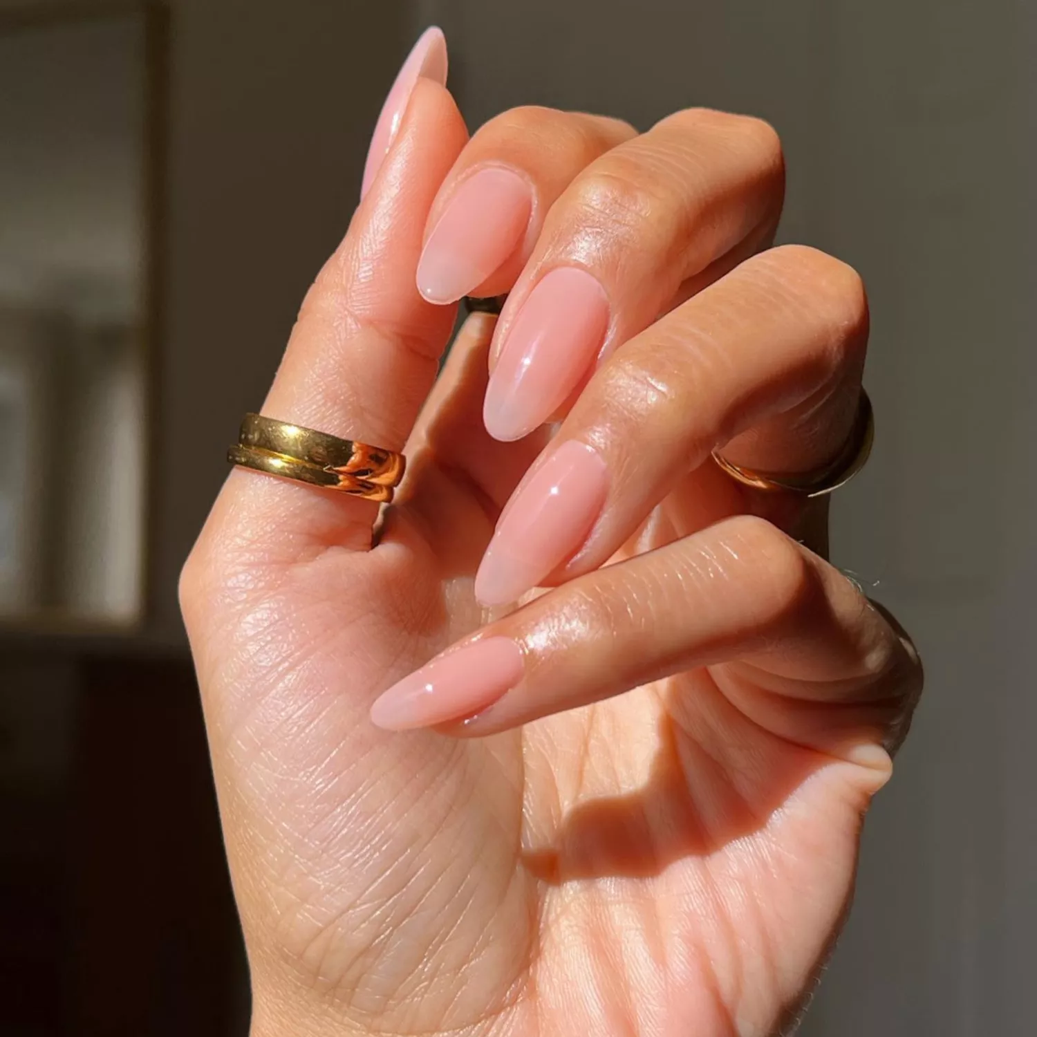 close up of nails in glossy neutral barely there hue