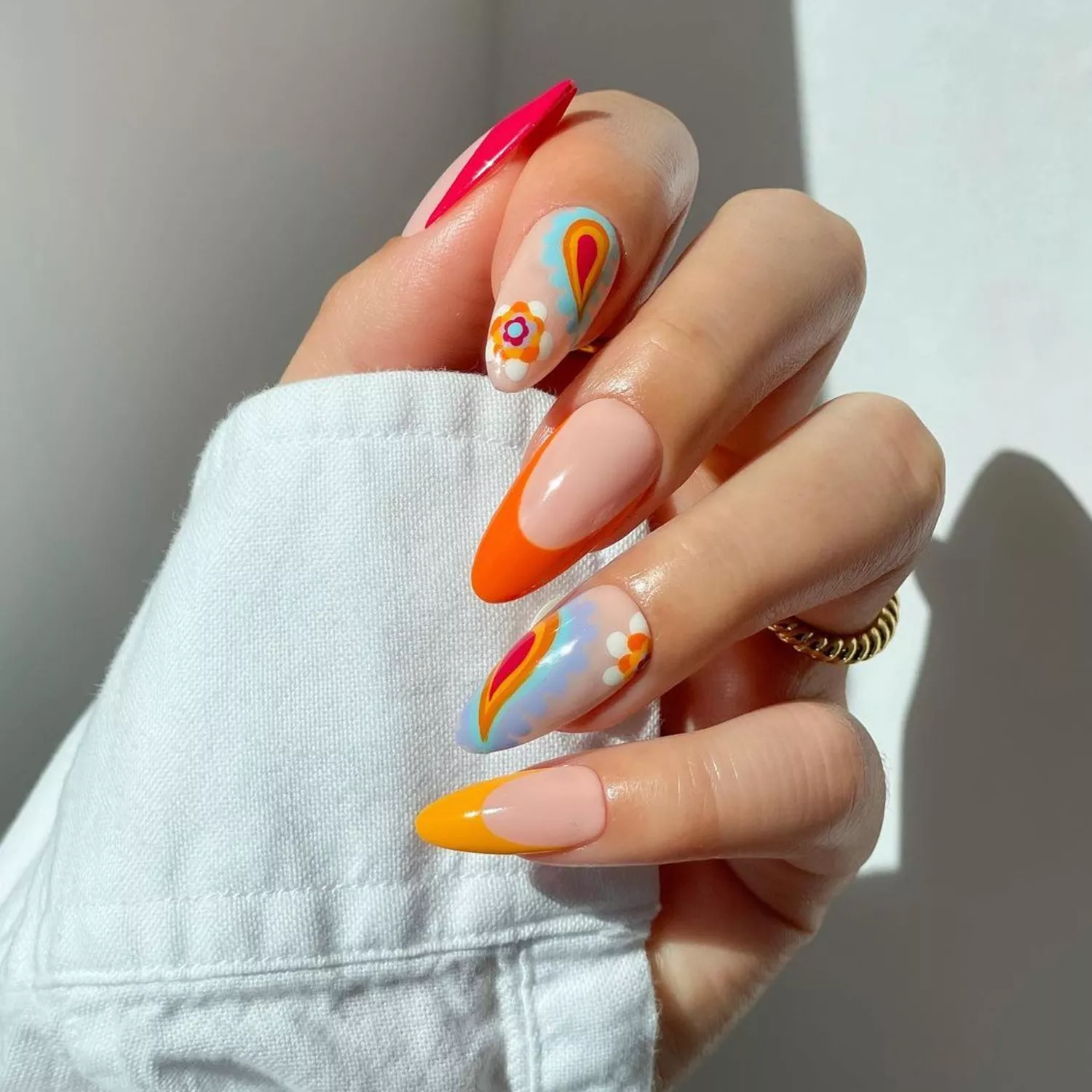 Bold orange, white, mustard, red, and blue paisley nails