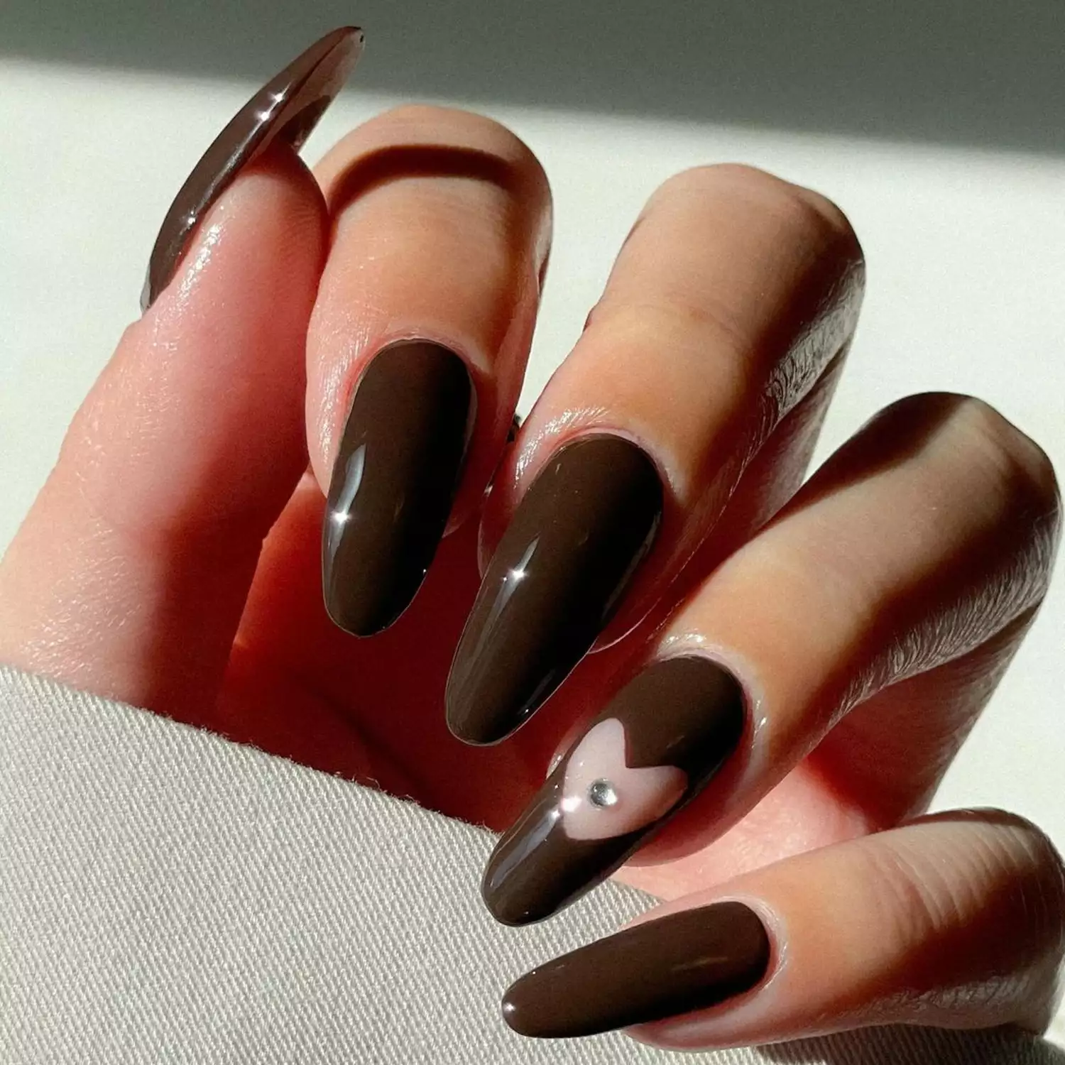 Heart Cutout Nails - Byrdie Dark Nail Ideas