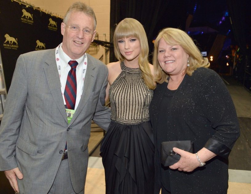 Taylor explained how 'hard' it has been for them as a family. Pictured with her parents; Scott and Andre, in 2013