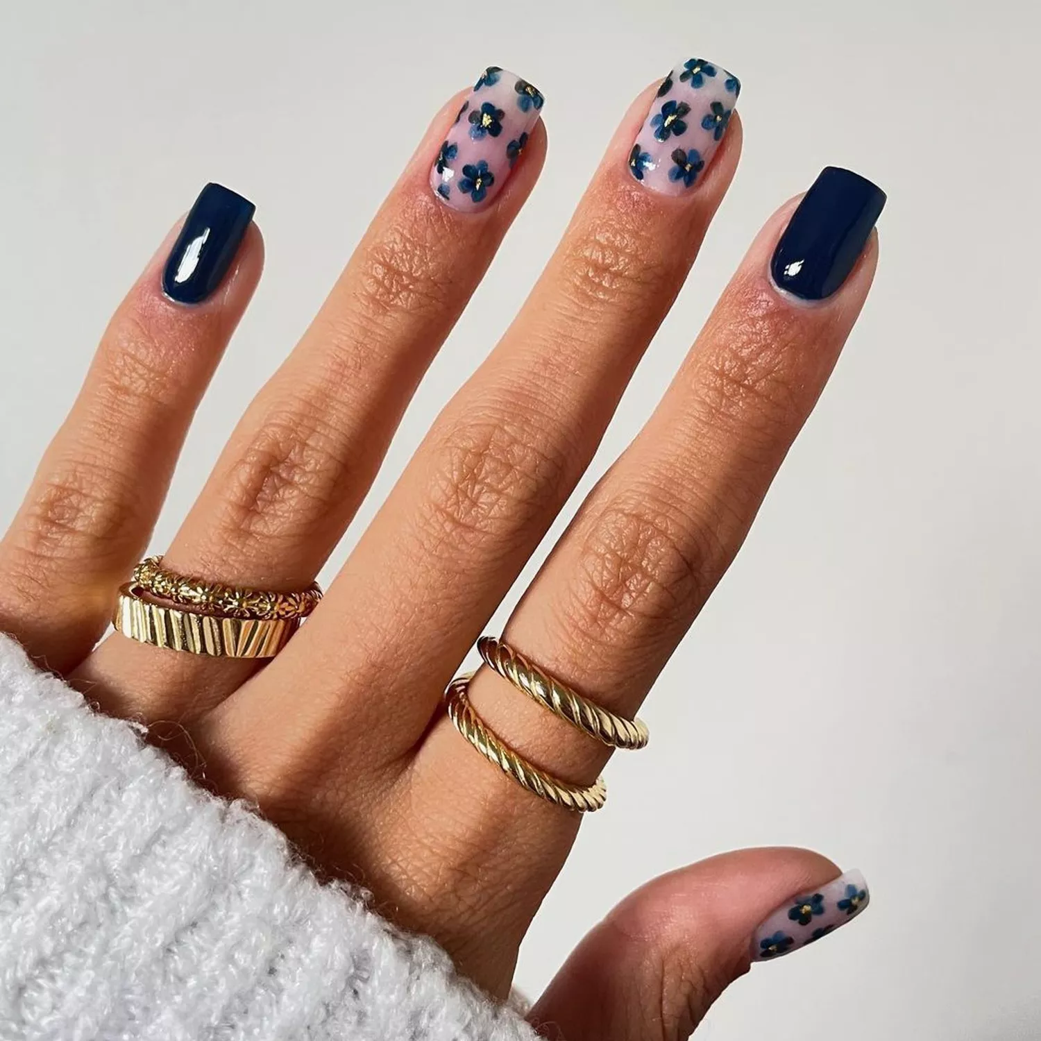 Navy Floral Nails - Byrdie Dark Nail Ideas