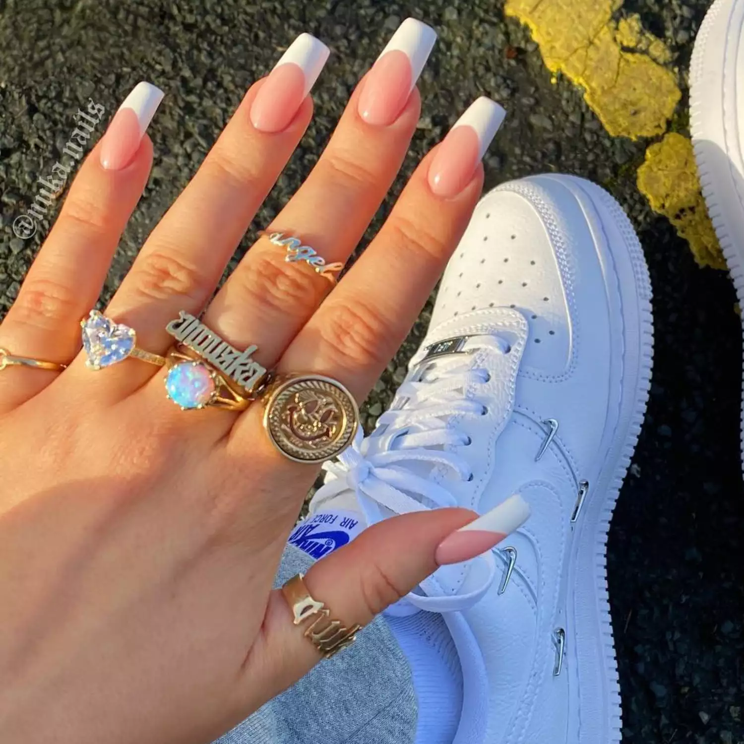 close up of nails with thick white french tip