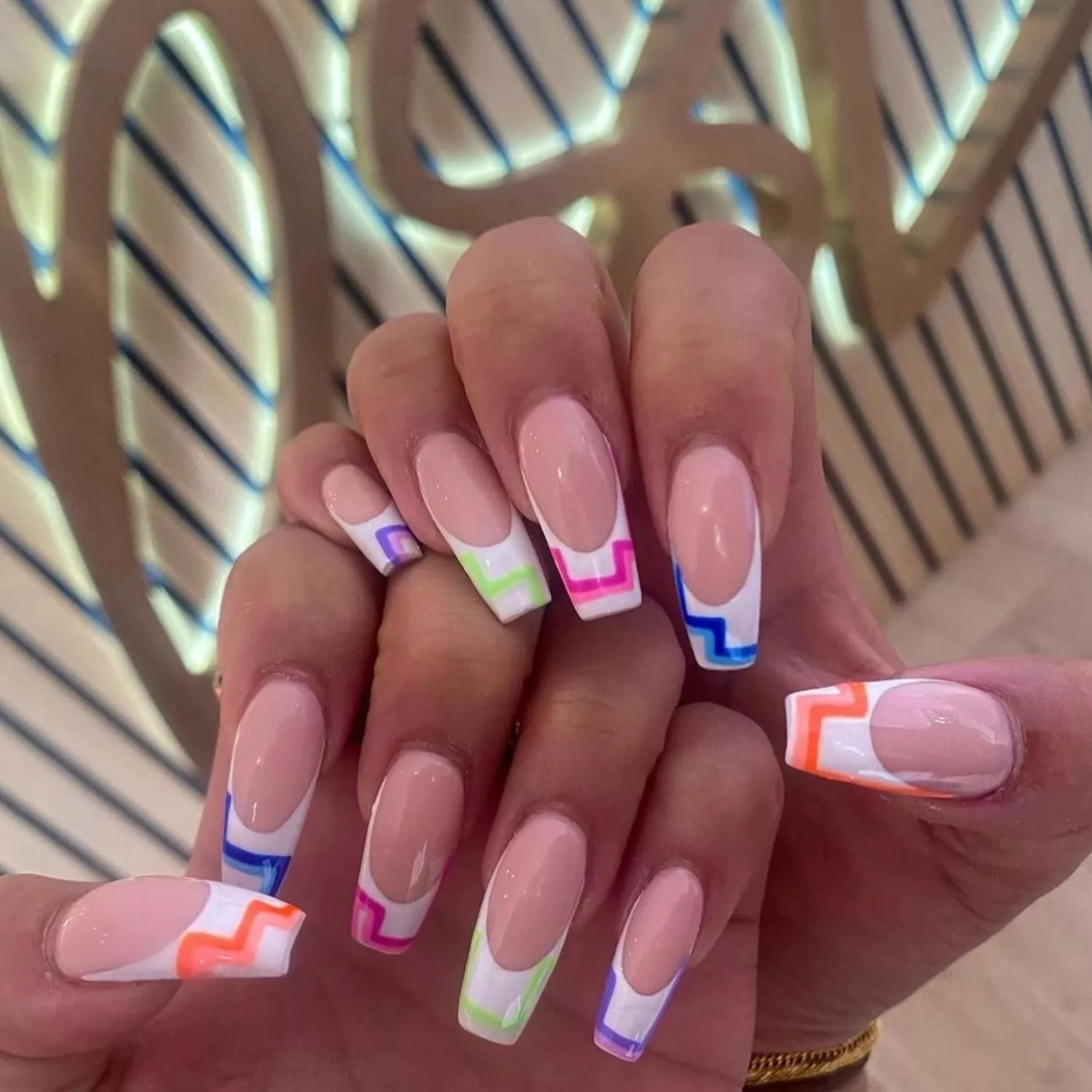 French manicure with bright geometric tips