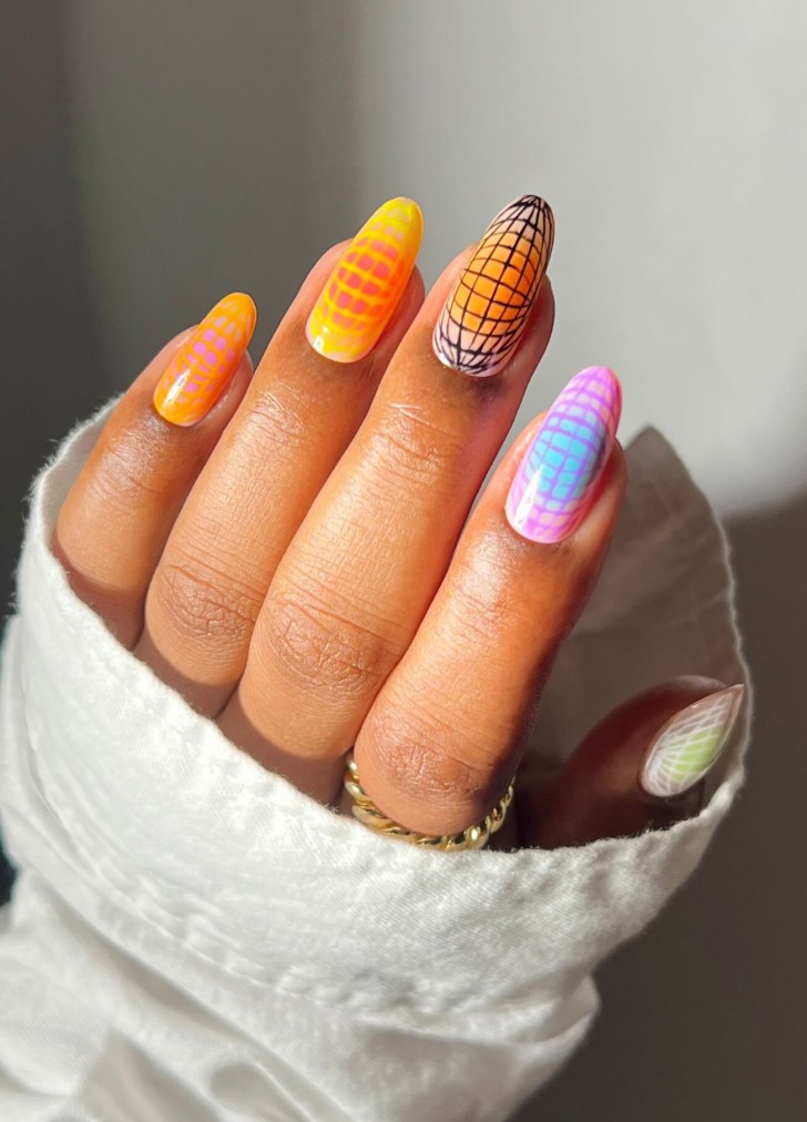 almond shaped geometric rainbow aura nails with a grid-like design