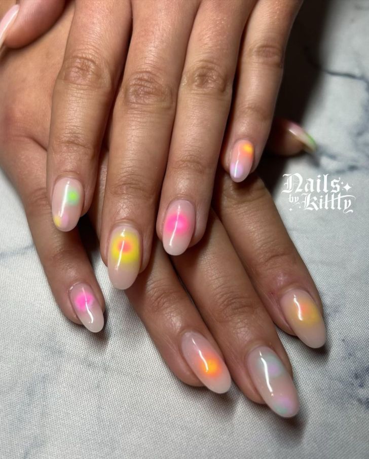 almond shaped neon rainbow aura nails with a clear base coat