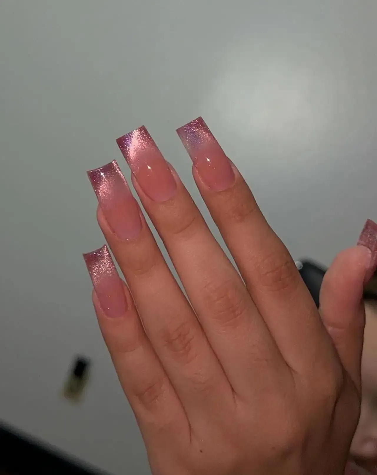 Pink cat eye ombre nails.