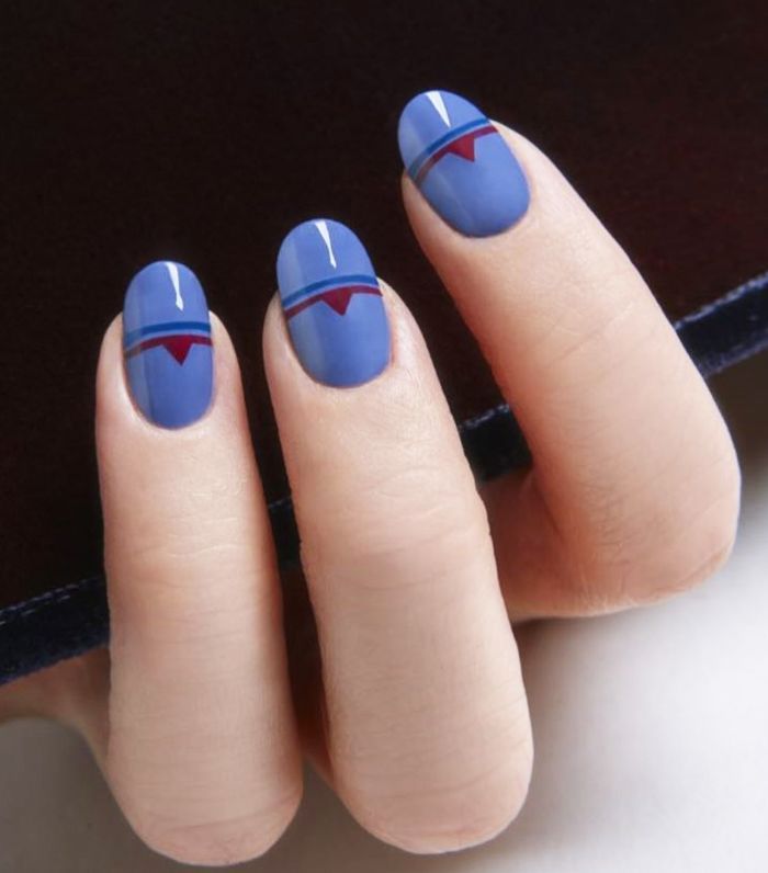 Blue geometric manicure with maroon details