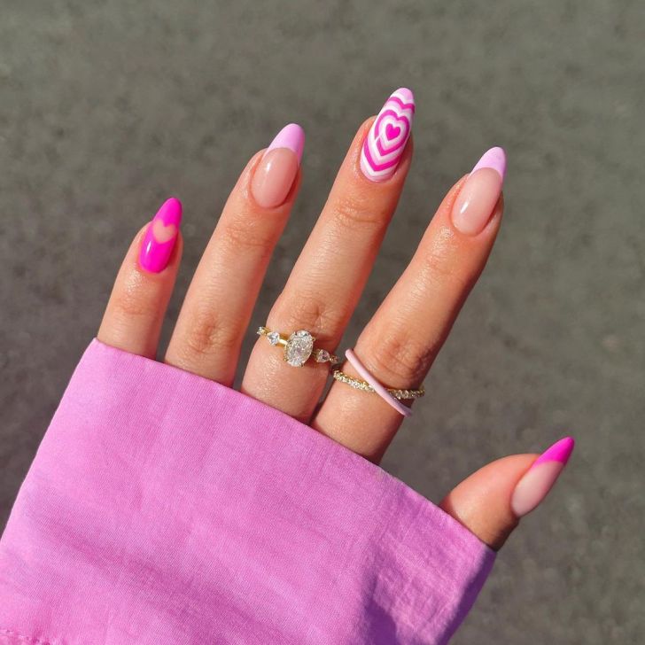 cute light pink french tip Valentines Day nails with mismatched heart designs