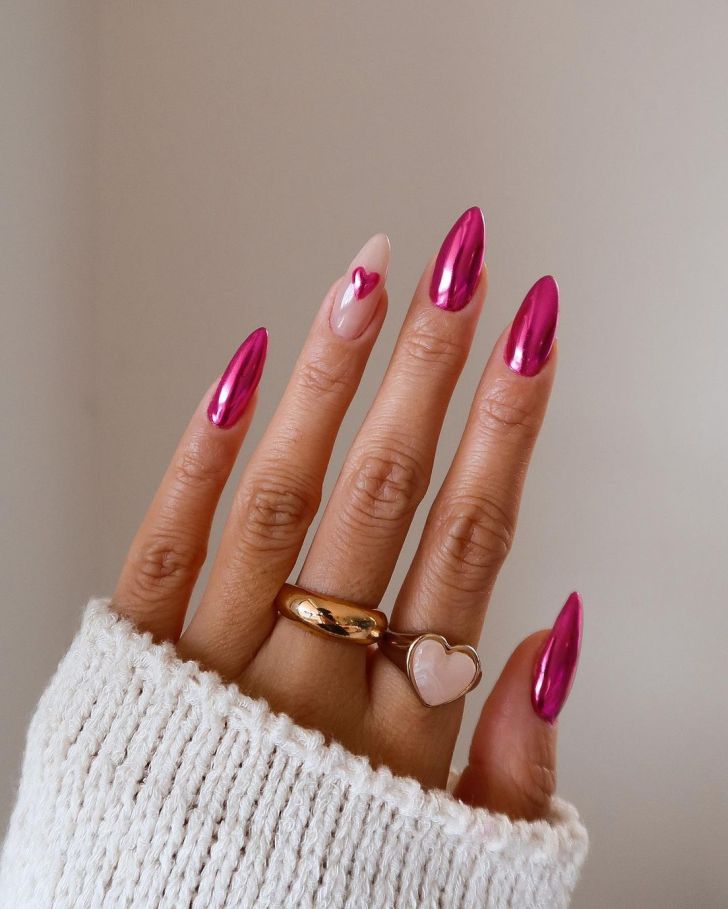 cute metallic bright pink simple Valentines Day nails with heart accent designs on one finger