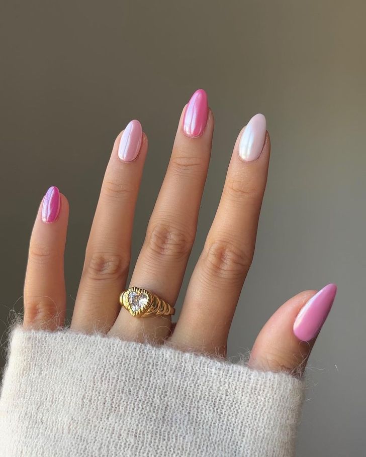 simple Valentines Day nails with a light pink skittle design and a shimmery glazed finish