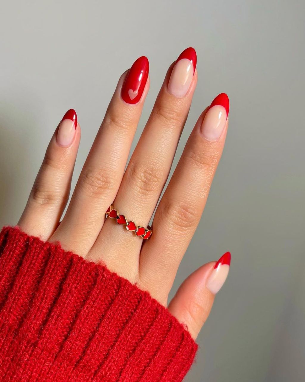 French tip red Valentines Day nails with cute pink heart accent nail art