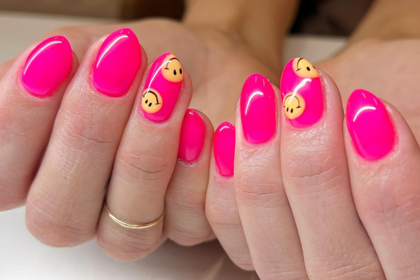 hot pink smiley face nail design