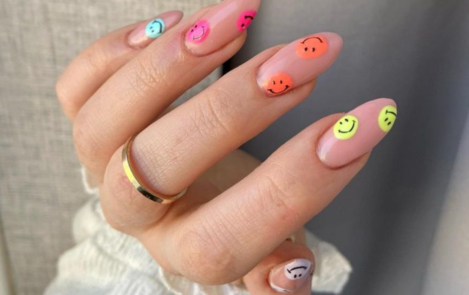 multicoloured smiley face nails design