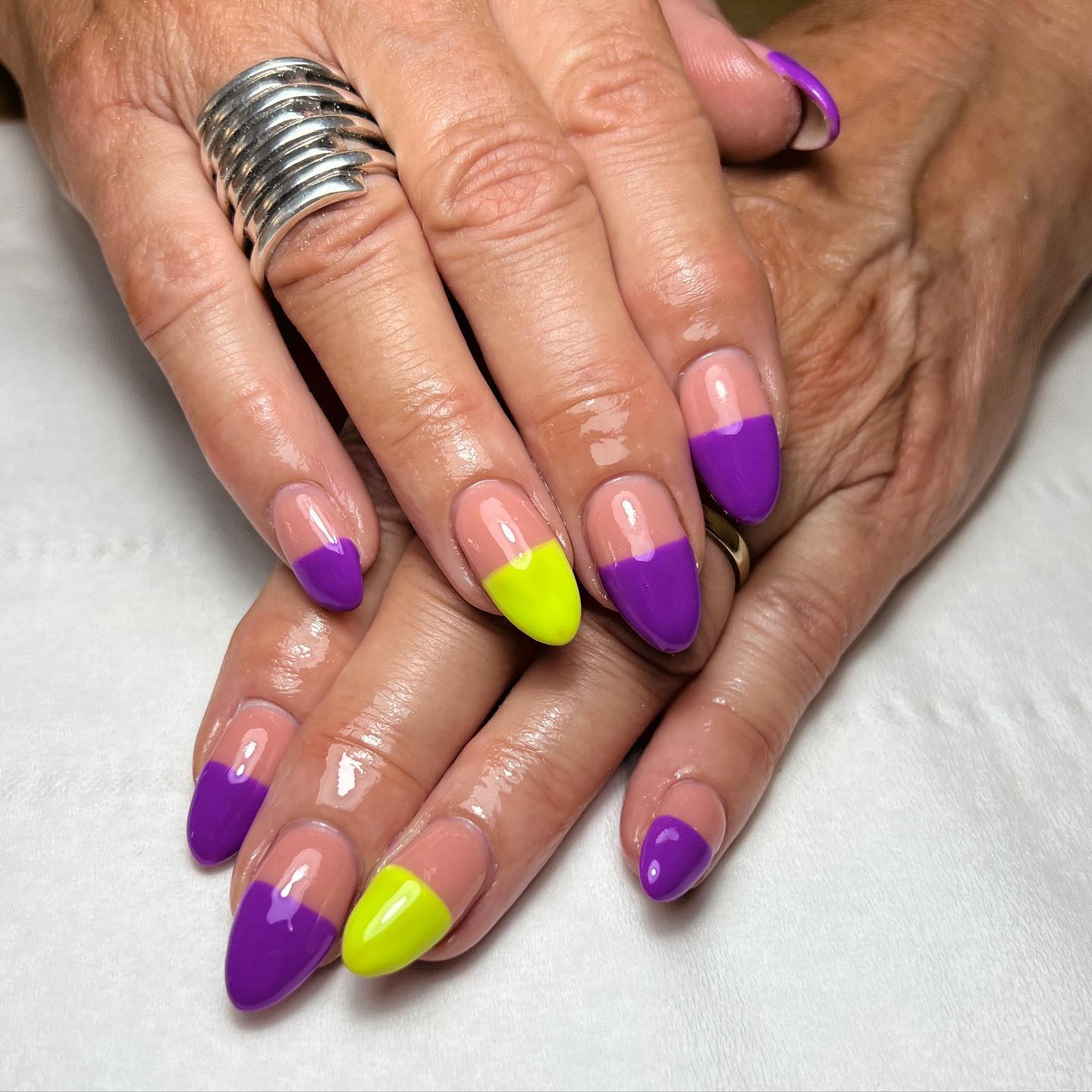 To stand out from the crowd, why don't you try something new? In this nail design, nude, purple and yellow colors are used to give a half nail design look.