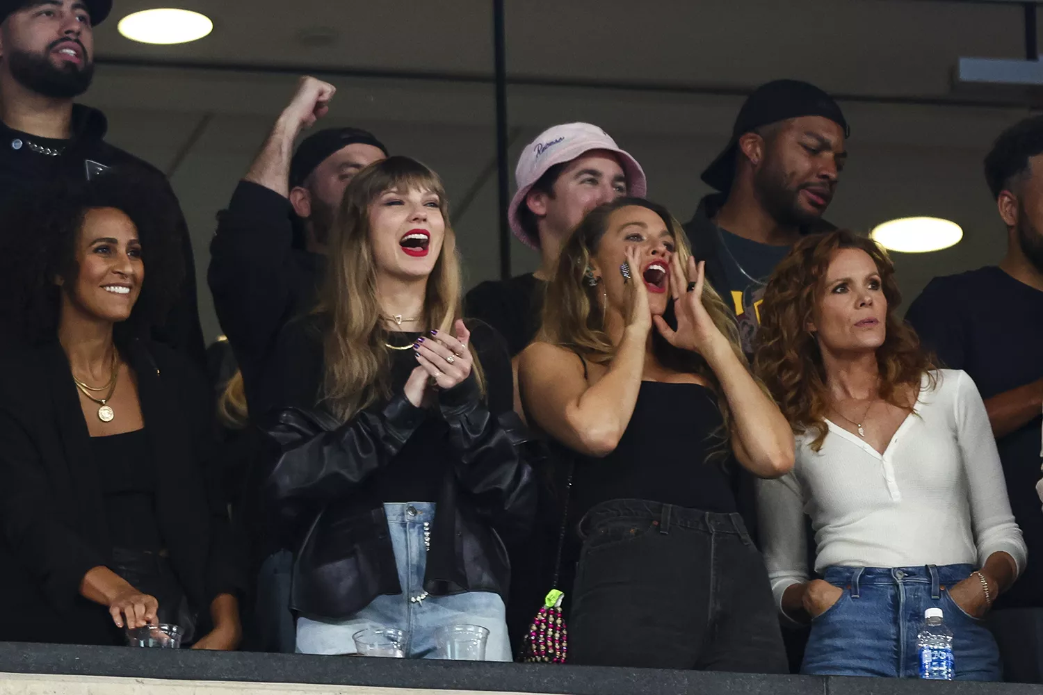 Taylor Swift and Blake Lively cheer from the stands during an NFL football game between the New York Jets and the Kansas City Chiefs