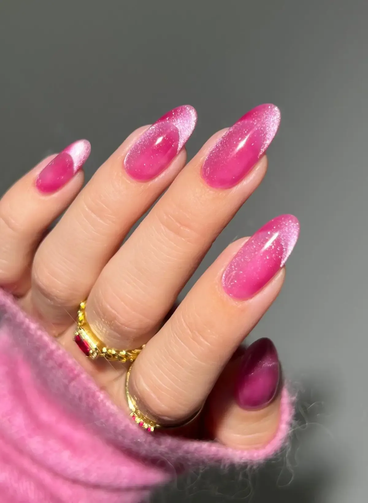 Pink cat eye nails.