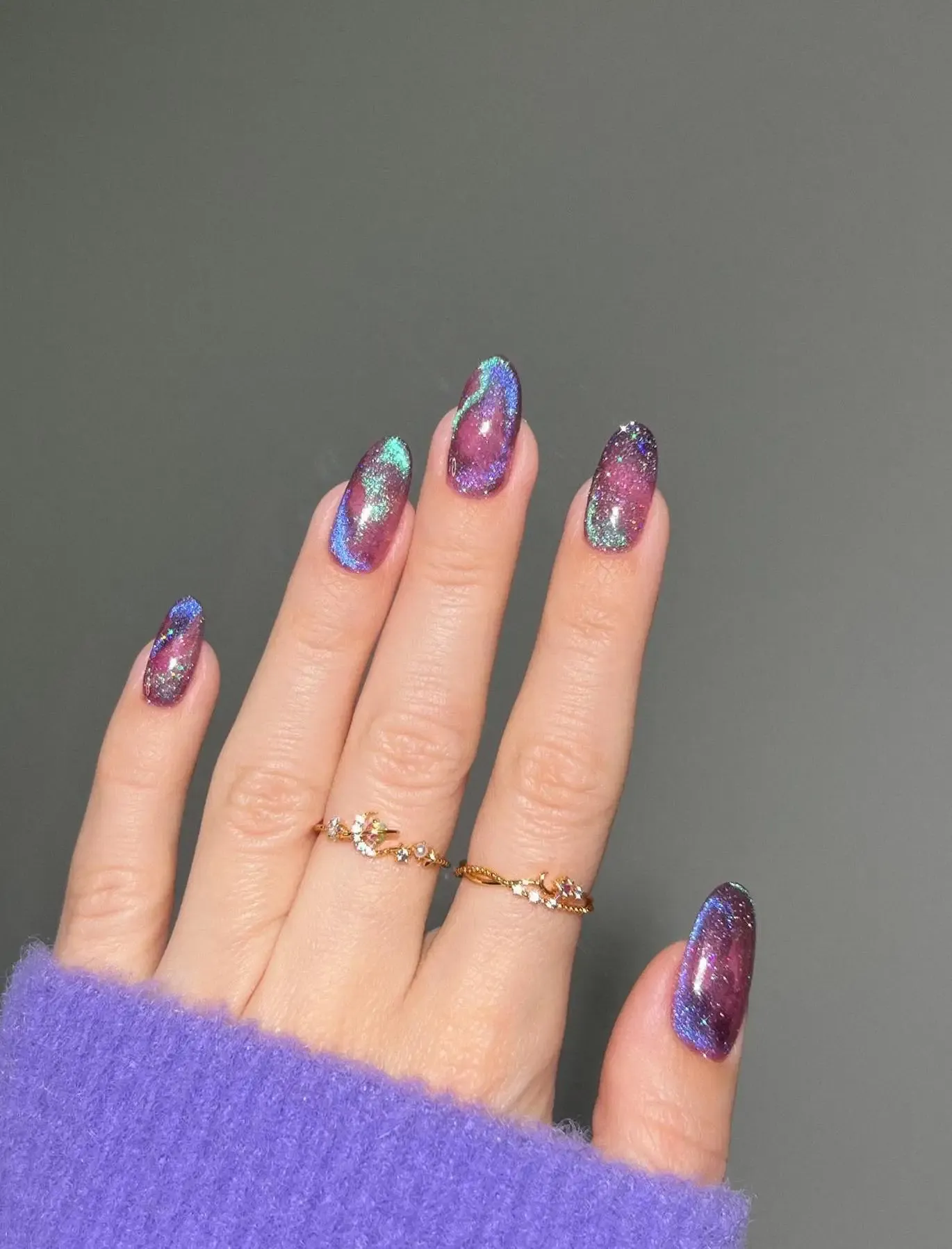 Purple cat eye nails.