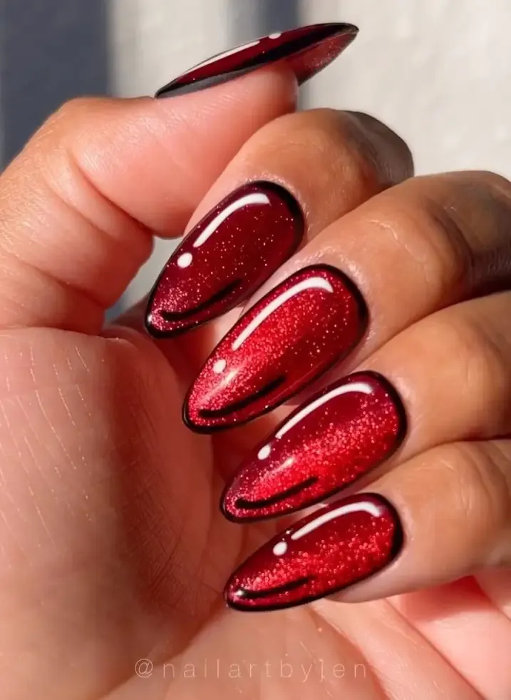 Red cat eye nails with pop art.