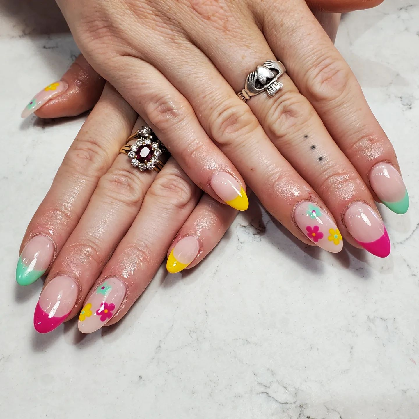 For your colourful french tips, here is one of the best accent nails. As you see, the flowers on the right finger are the same with the tips.