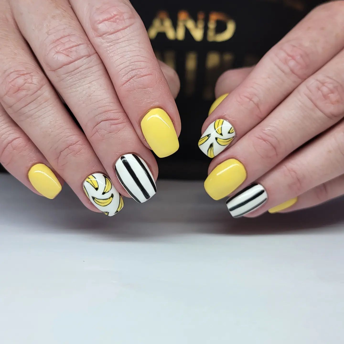 There are many banana inspired things and objects outside, so why not showing this iconic fruit as your accent nails?