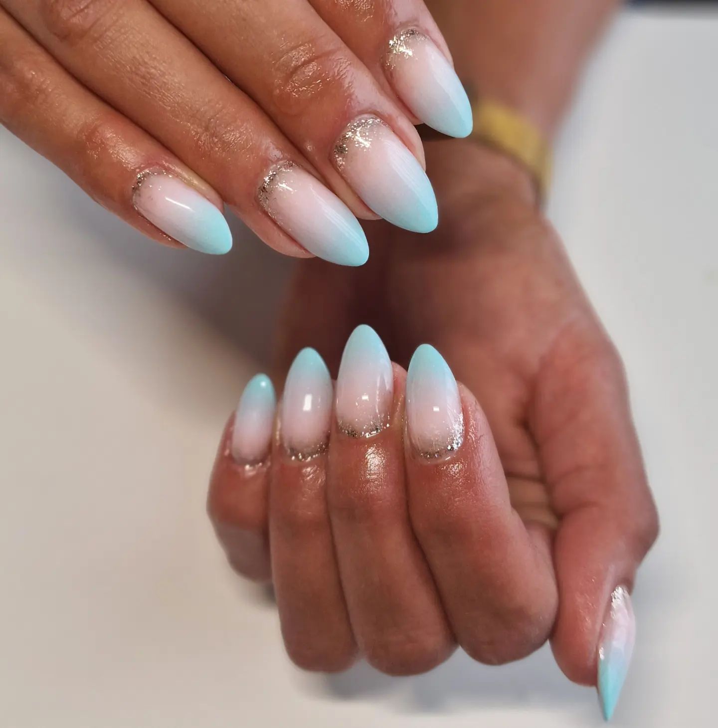 These ombre nails that light blue gets darker to the tips can be taken to a new level with some shiny glitters on top of your nails.