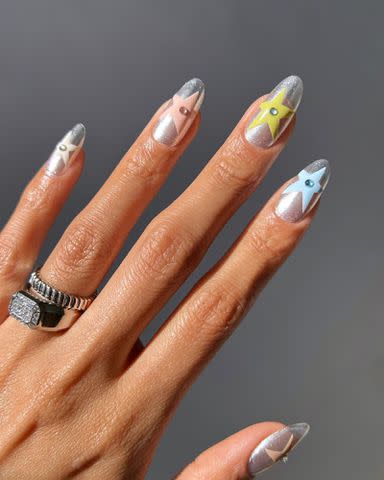 <p>Melanie Graves Instagram</p> Star nails by @overglowedit.