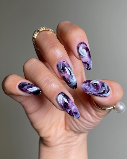 Purple watercolor nails are on-trend.