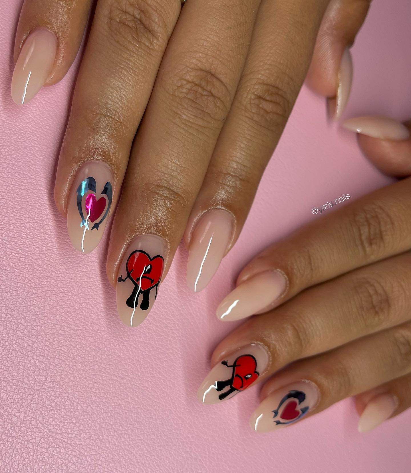 If you are bored with your simple and plain nails, you can try heart nail stickers like the ones above.