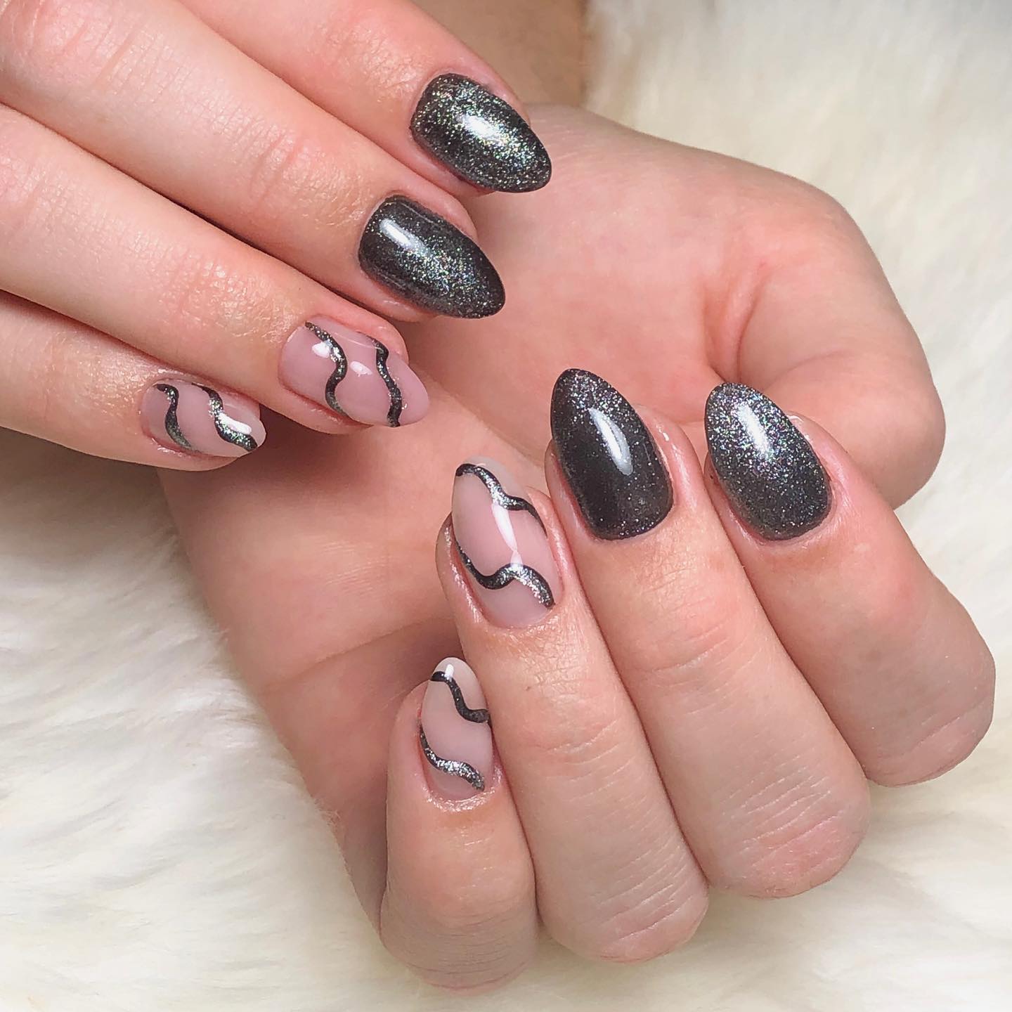 Those who doesn't find one nail art enough and want more of it will adore this nail design. Light and dark silver aurora nails will shine out with your swirl nail art.