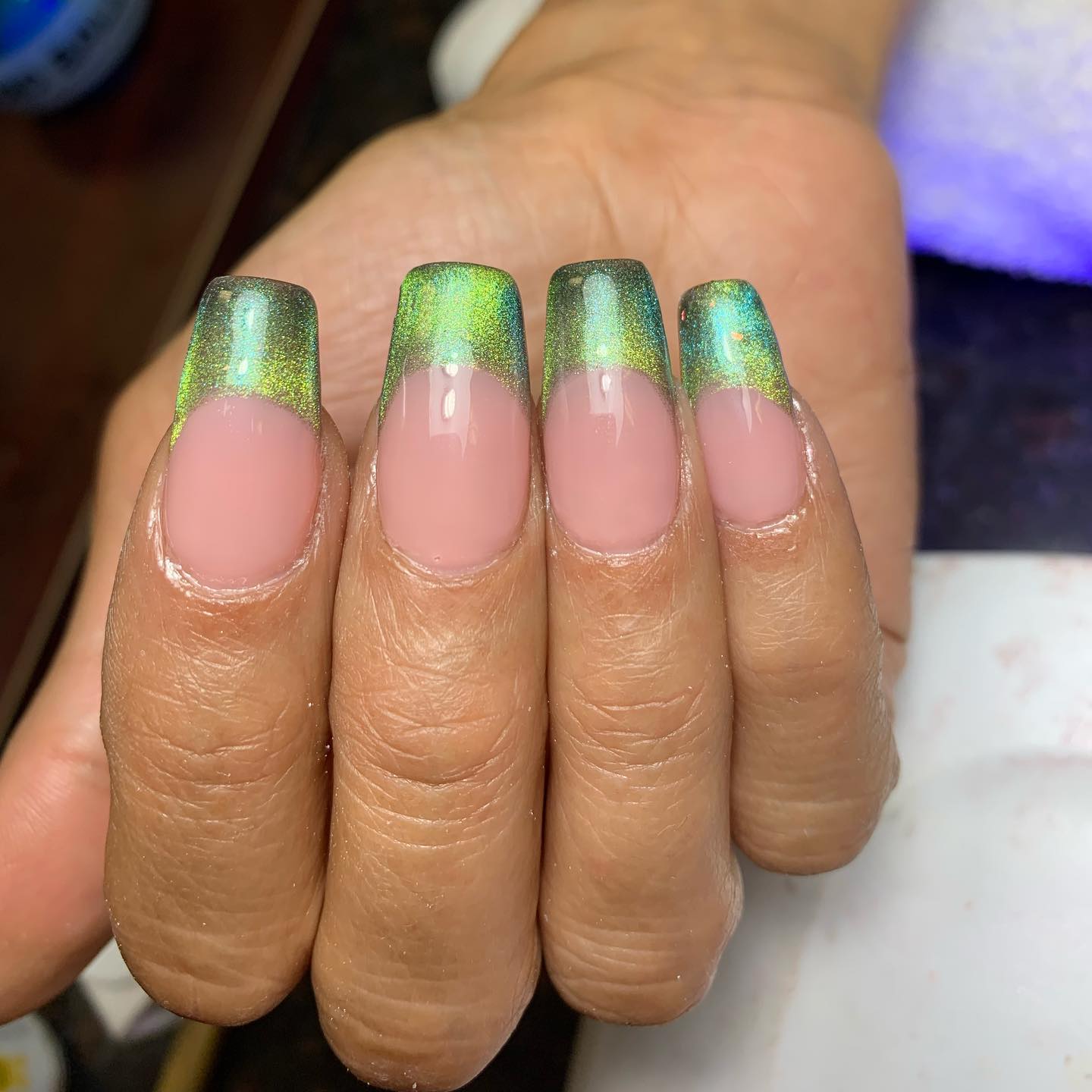 Green is always a great option when it comes to nails. Wanna take your green nails to a different level this time? Then, green cat eye French tips are for you.