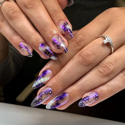 Purple blooming gel nail art is on-trend.