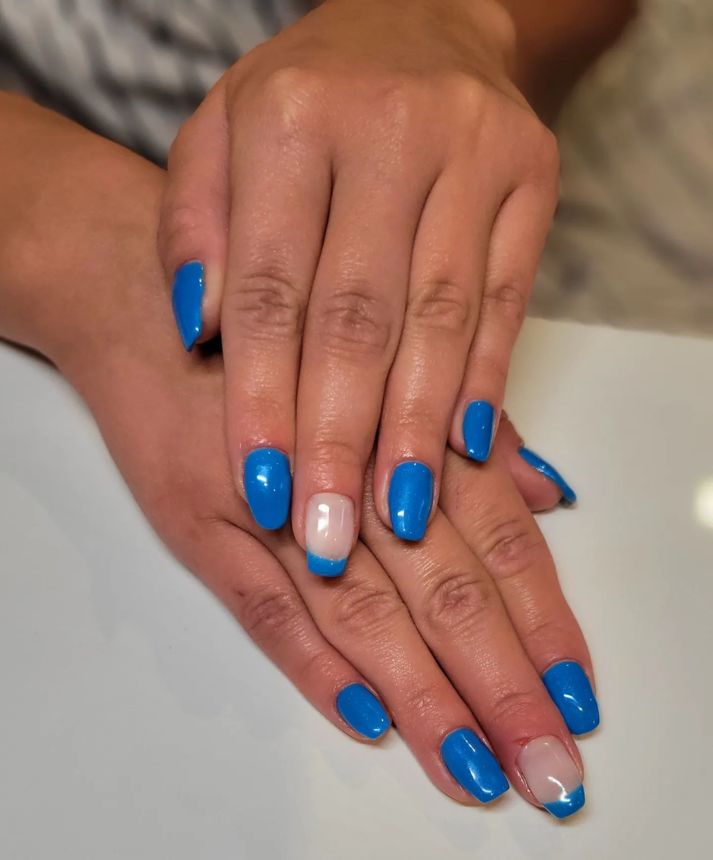 Blue is taken to a new level when neon version of it is used. Your medium-length blue neon nails will look amazing with French accents.