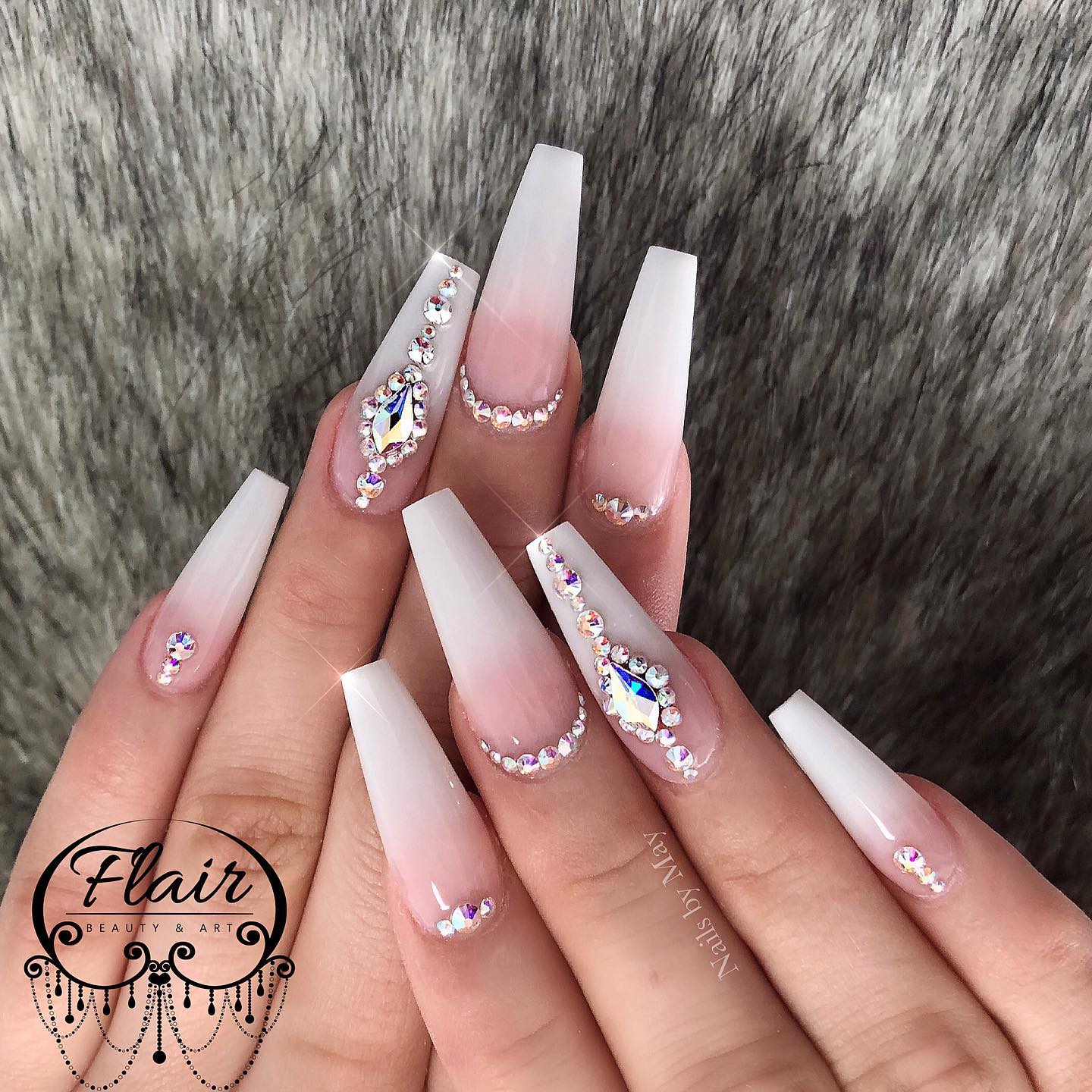 Those who want to get a nail design that make everyone speechless will adore these pink and white ombre nails. With these nails design, you will be on stage because of the shiny stones.