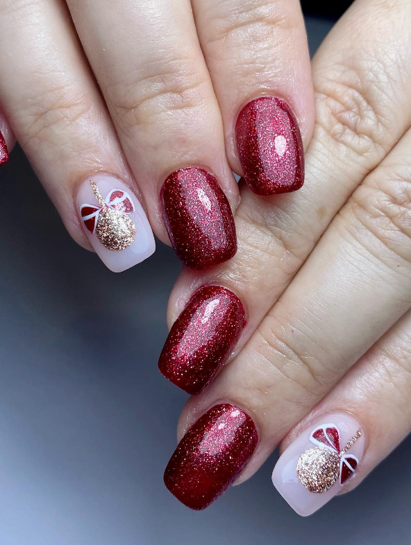 red glitter nails and baubles with bows