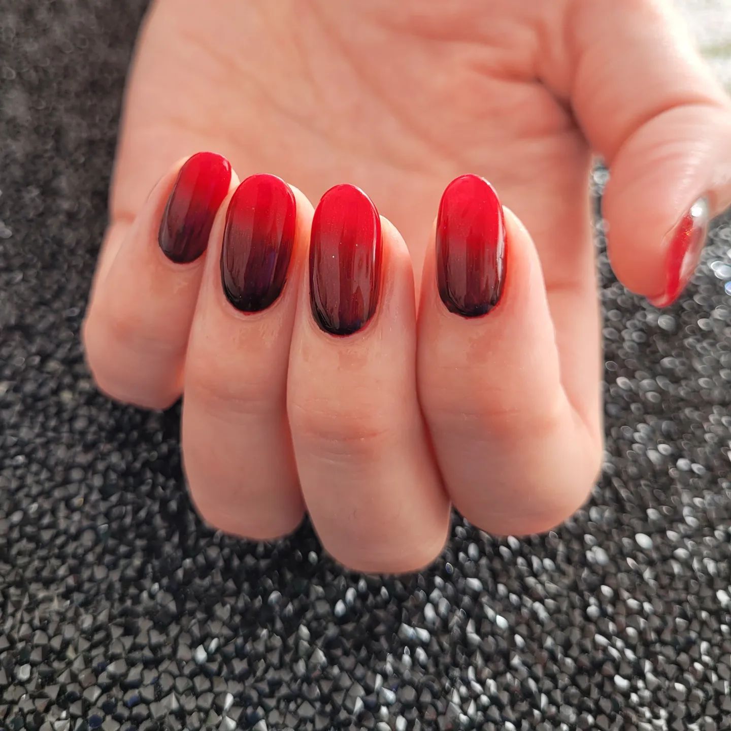 Ombre nails are always a favourite, aren't they? It starts with black color and turns into red to bottom. No matter how long your nails are, you will look gorgeous with this design.