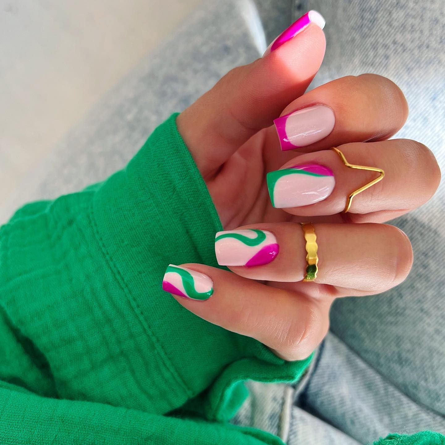 Here is a nice and unusual example of swirl nails. Dark pink and green nail polish go with each other on a pastel pink base.