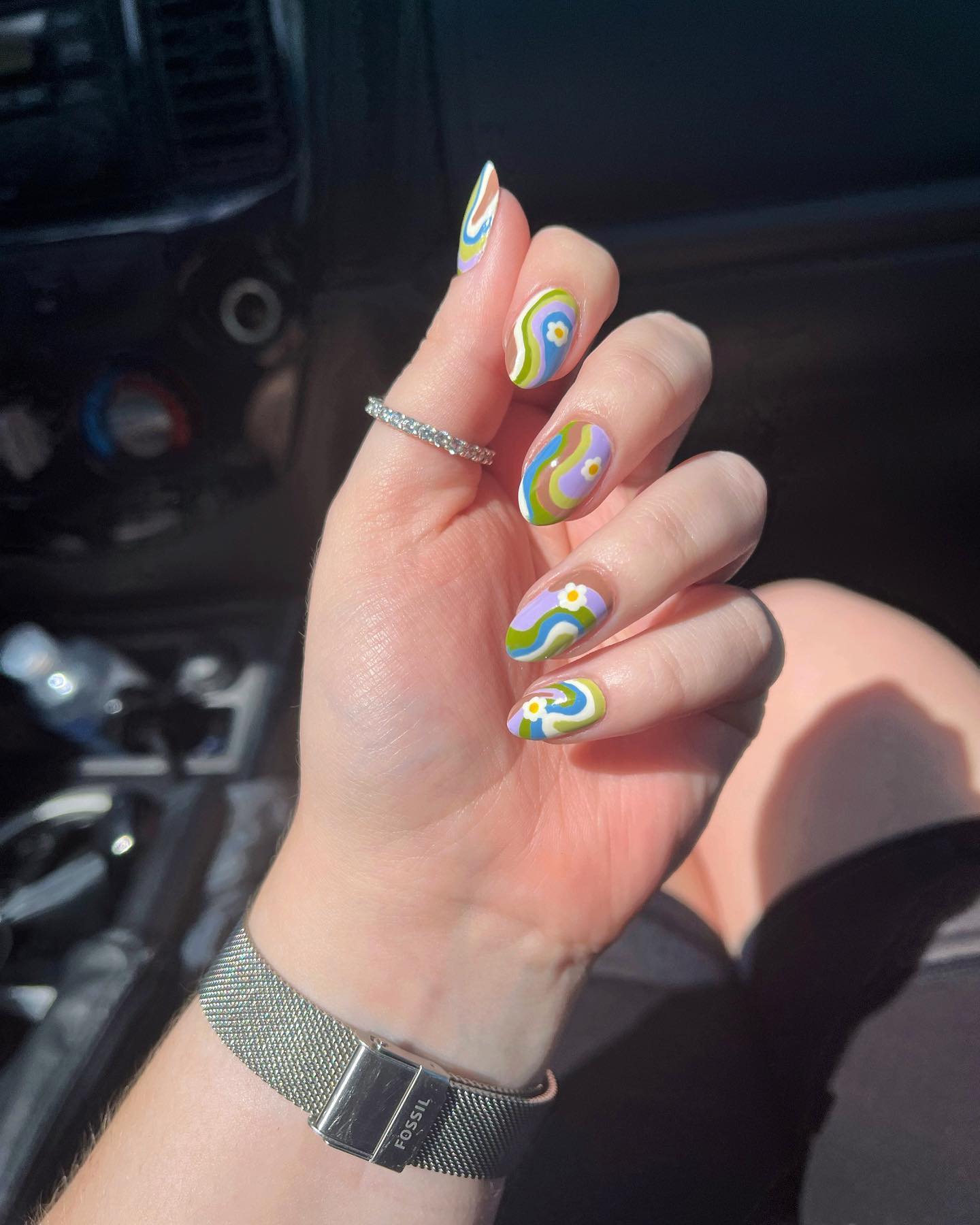 Pastel colors are for those who don't prefer to have bright and shiny nails. So, why don't you have pastel colored swirl nail art and look amazing?