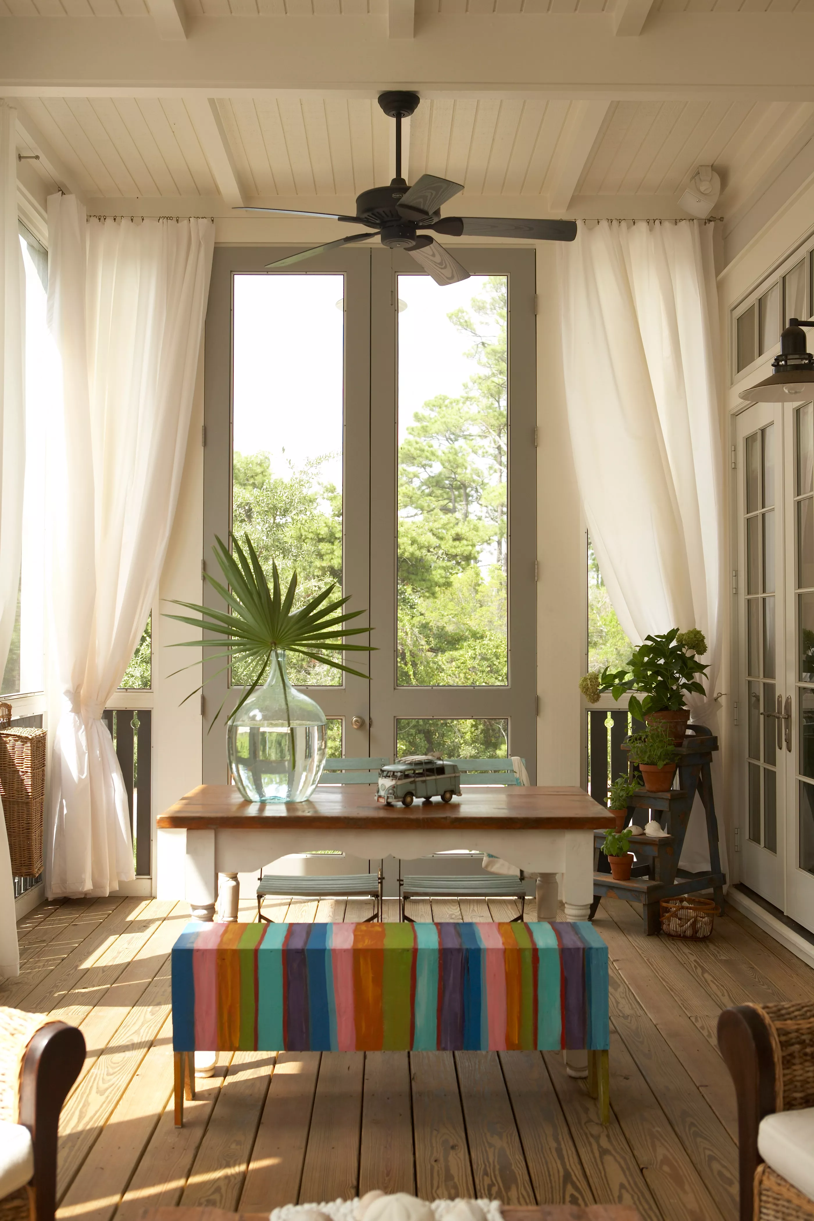 porch with curtains and dining table