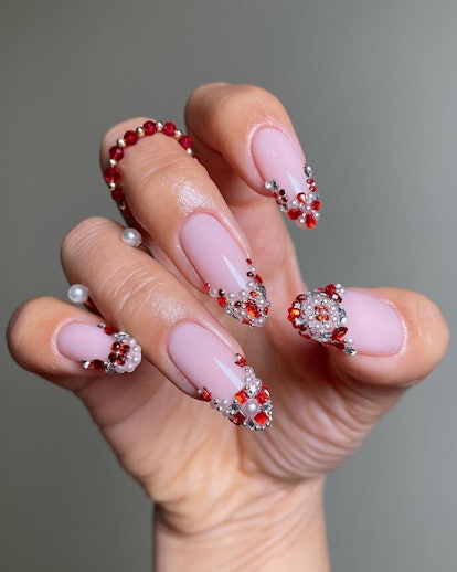 Bedazzled French tip manicures are trending for Aries season 2024.