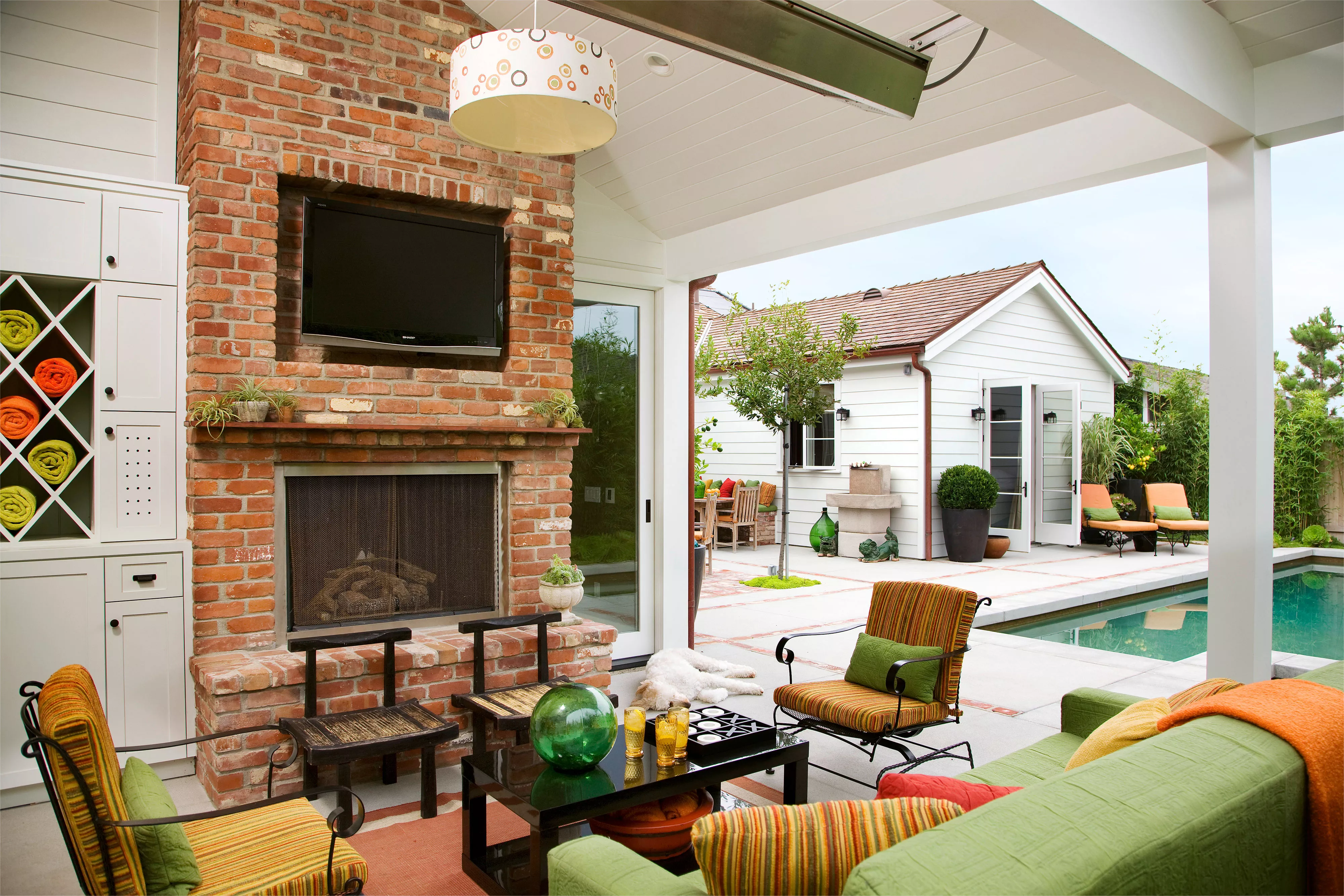 Backyard deck fireplace with TV