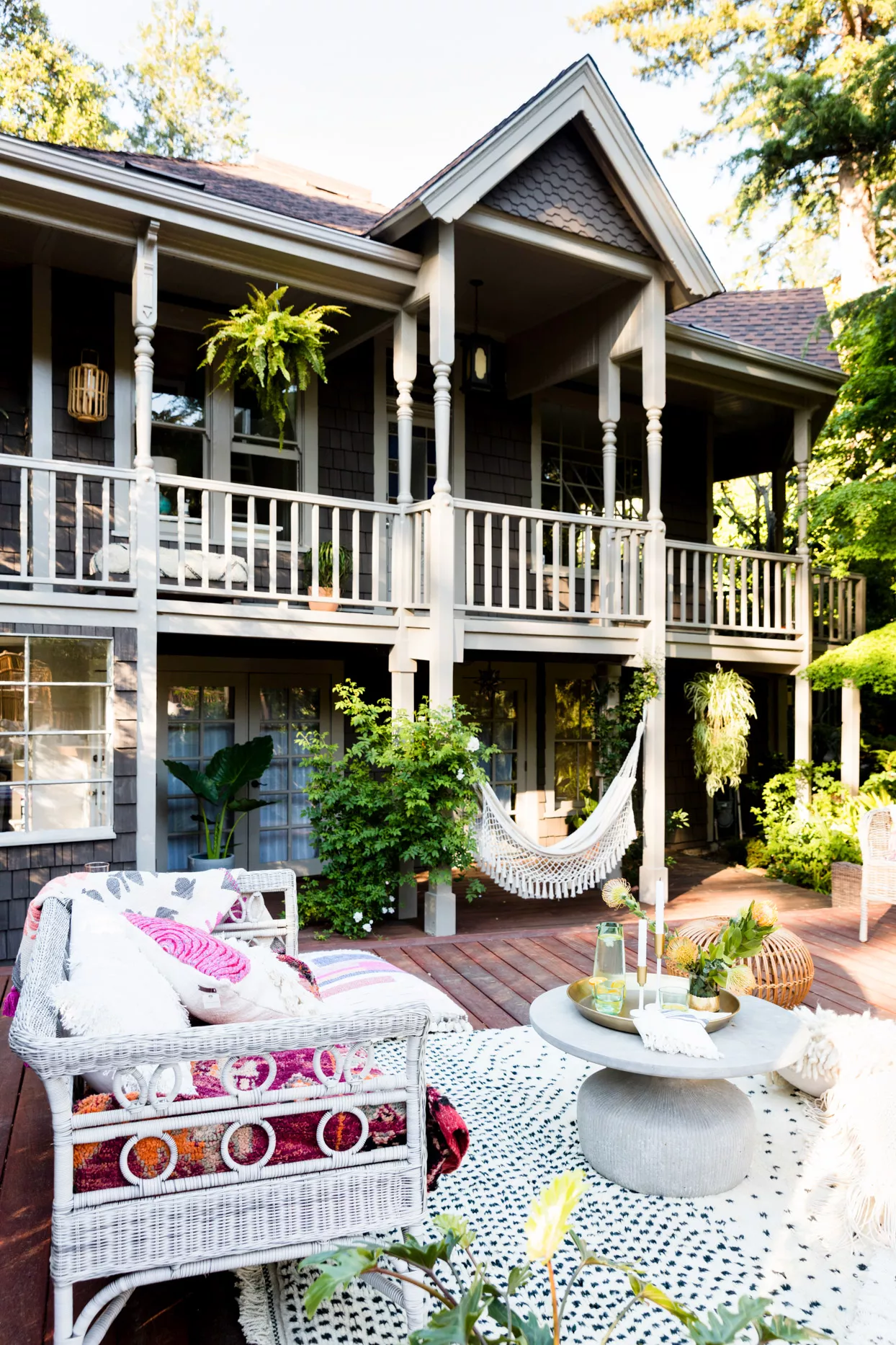 artsy back porch decor with balcony and hammock