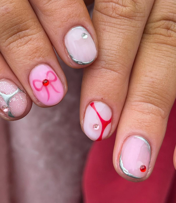 baby pink mismatched nails with bows